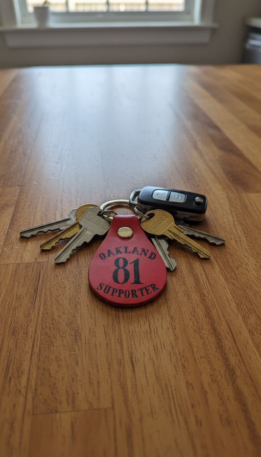 Support Oakland leather keychains